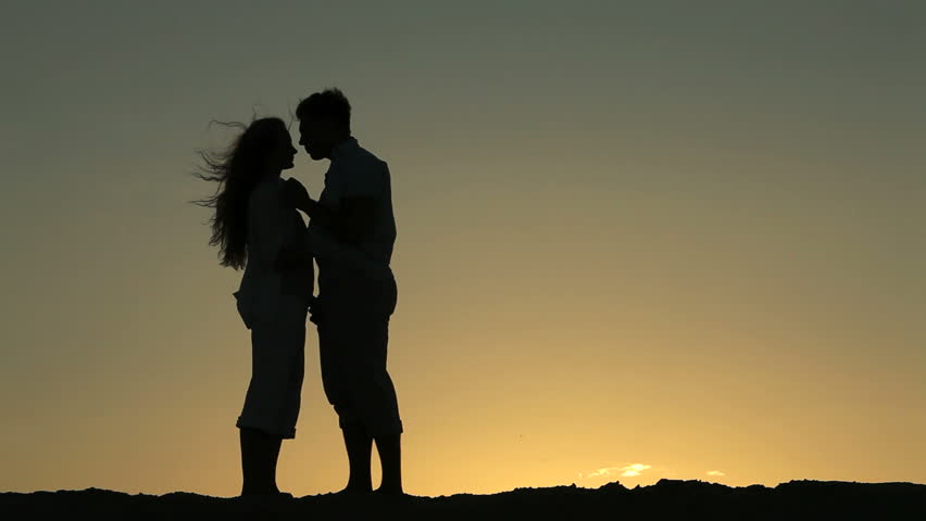 Lovers meeting, kissing, embracing and walking away together