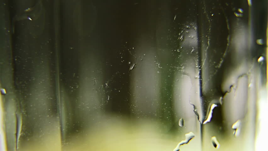 Macro clip of liquid, bubbles and froth. Abstract video that could be used as effect, transition or background and even as a conceptual video.