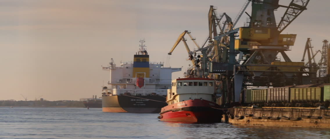 RIGA - CIRCA MAY 2012 - Cranes loading cargo onto ships at a port in Riga, Latvia.