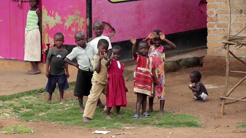 UGANDA, AFRICA - JUNE 10: Ugandan Children Play and Wave for the Camera on June 10, 20012 in Uganda, Africa. People are ver friendly in this country, and children especially love their picture taken.