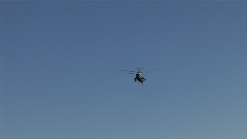 Washington, D.C. - CIRCA April, 2006: The Presidential Helicopter, Marine One, flies past the Washington Monument on a clear sunny day