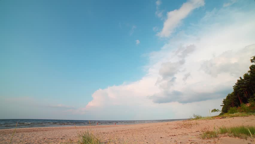 Clouds over beach of gulf of Riga, Baltic sea.