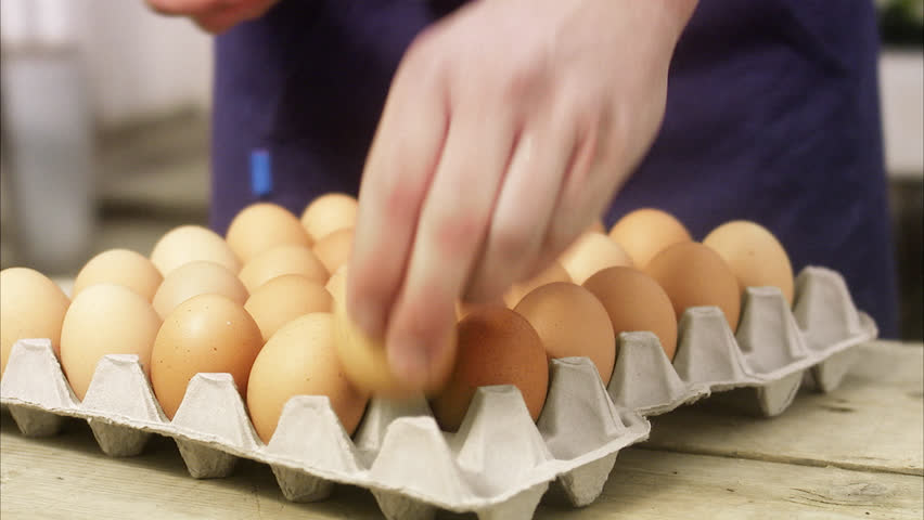 Farmer with crate of eggs