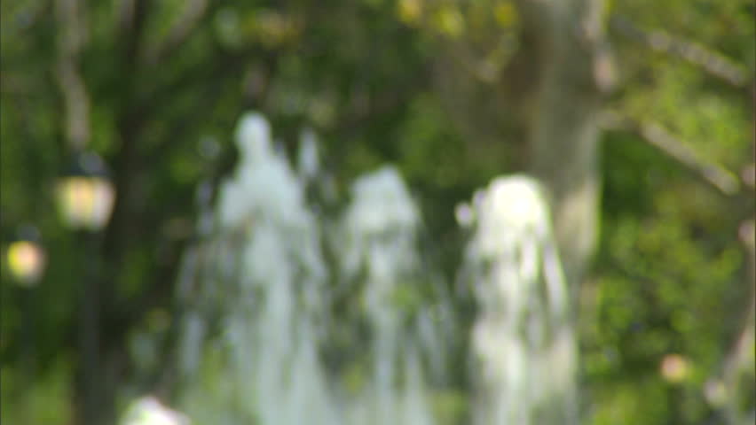 Shot of water spewing from a fountain in a park