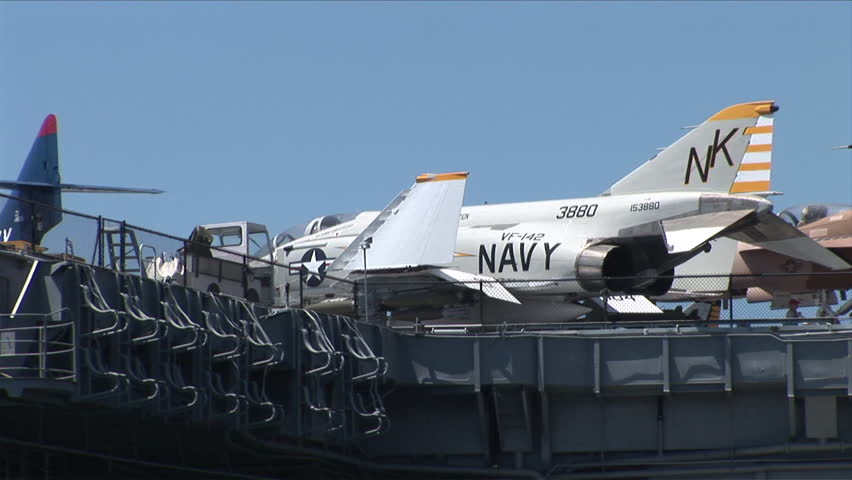 San Diego, CA - CIRCA June, 2008: View of a jet fighter plane sitting on the deck of an aircraft carrier during the day