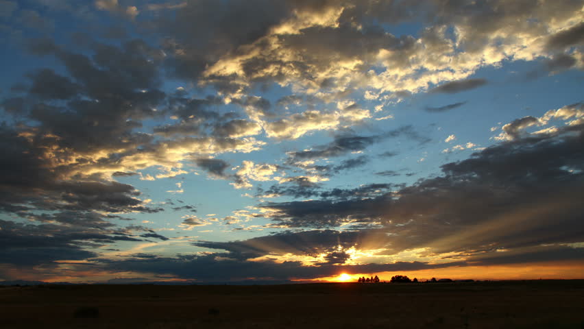 Glorious summer sunset after a rain storm. HD 1080p time lapse.