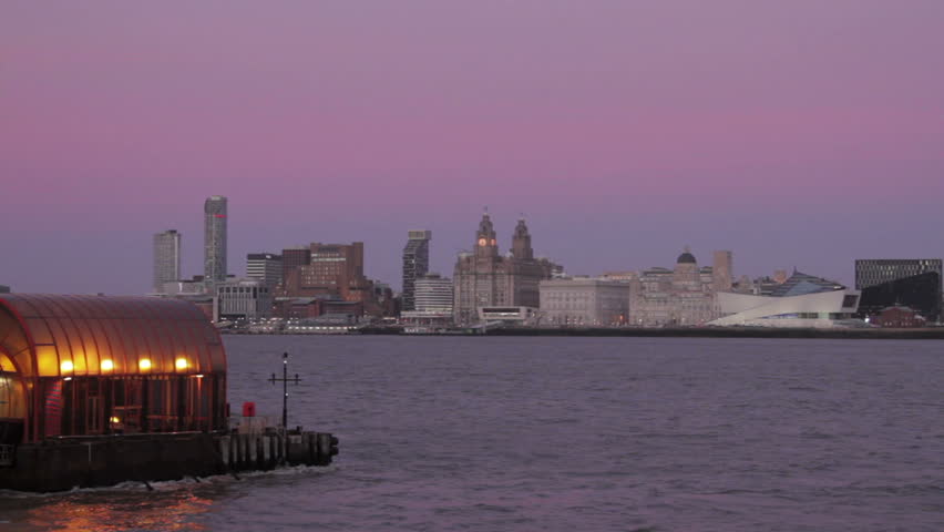 Liverpool skyline at sunset with the Wirral Woodside ferry terminal in the foreground