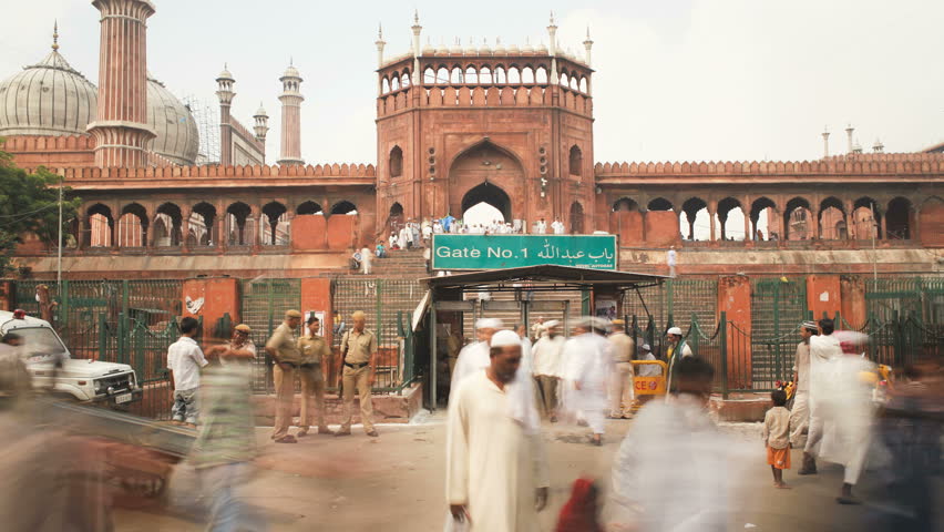 OLD DELHI, INDIA - CIRCA MAY 2011: People leaving the Jama Masjid (Friday Mosque) after the Friday Prayers