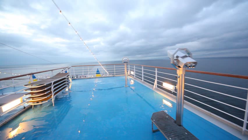 main deck of floating ship with survey field-glasses and view of stern in cloudy weather