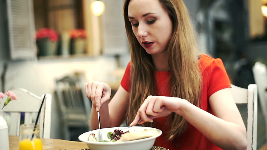 Young Woman Having Dinner At A Restaurant In Downtown Stock Footage Video 1338199 Shutterstock 8937