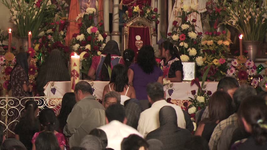 MEXICO - CIRCA 2010: Parishioners Make Their Way to the Alter In A Catholic Church
