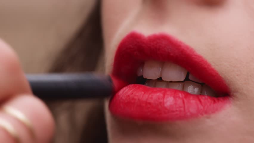 Smiling Woman Putting Lipstick On Her Lips On White Background Stock