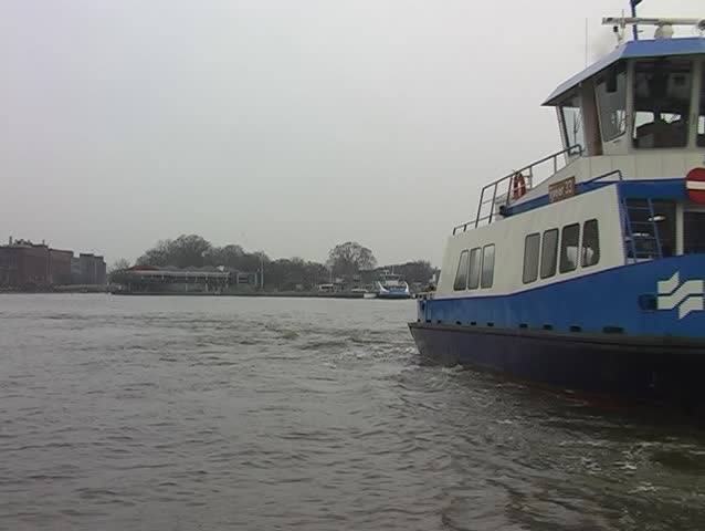 Ferry shuttle in Amsterdam harbor in holland