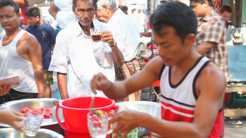 YANGON, MYANMAR - APRIL 28: Lemonade seller  in Yangon activity on April 28, 2012 in Yangon. Yangon is the capital city of Myanmar.