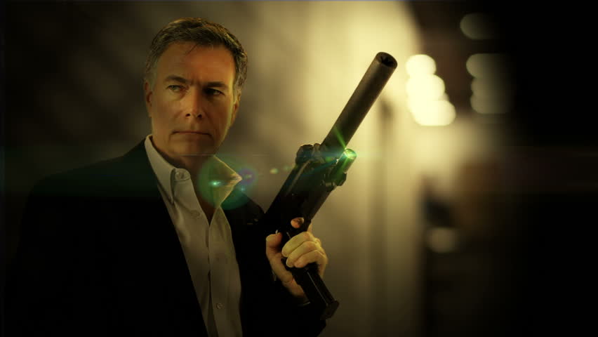 secret agent or security personal in a dimly lit room