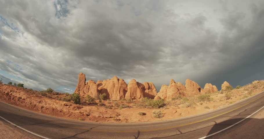 Fisheye storm clouds above red rock in Arches National PArk - Moab, UT 4K