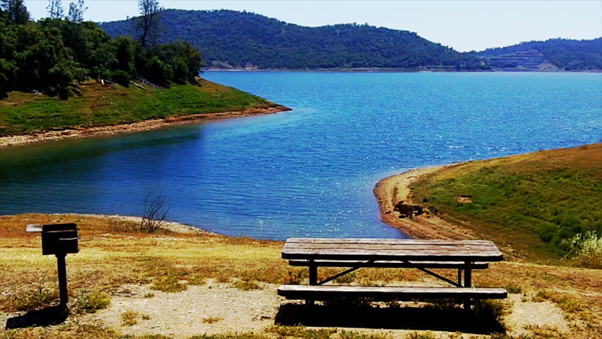 A quiet cove and picnic table on New Melones Lake in Calaveras County near Angels Camp, CA. This reservoir supplies water for cities and farms in Central California and is a popular recreation spot.