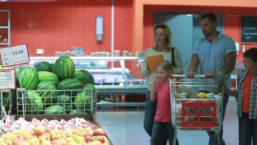 Parents and kids choosing products from the list uploaded to the digital pad
