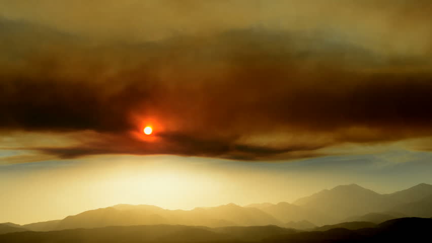 Time Lapse of Smoke Clouds from Forest Fire at Sunset

