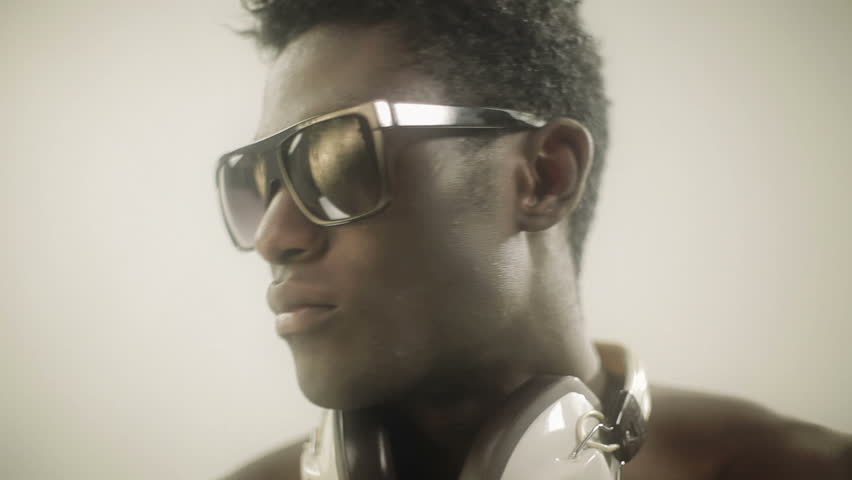 young african guy waving and dancing with a cool attitude