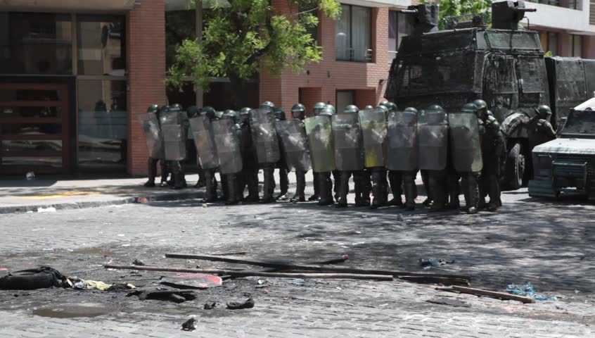 SANTIAGO, CHILE - OCTOBER 19: Chilean riot disperse protesters during a student strike on October 19, 2011 in Santiago, Chile. Protesters demand the government to improve education quality