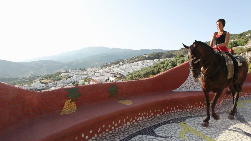 Woman riding a horse in Andalusia, Spain