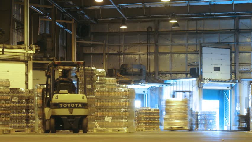 MOSCOW - MAY 31: (Timelapse View) Loader Toyota delivers containers with kvass in lorry at nonalcoholic plant Ochakovo, on May 31, 2012 in Moscow, Russia