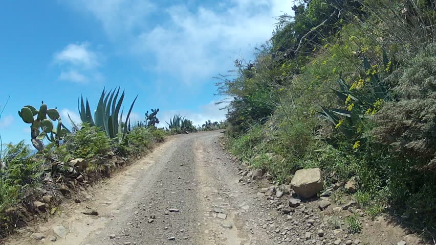 Driving Over A Dirt Road in the mountains of Tenerife, Spain.