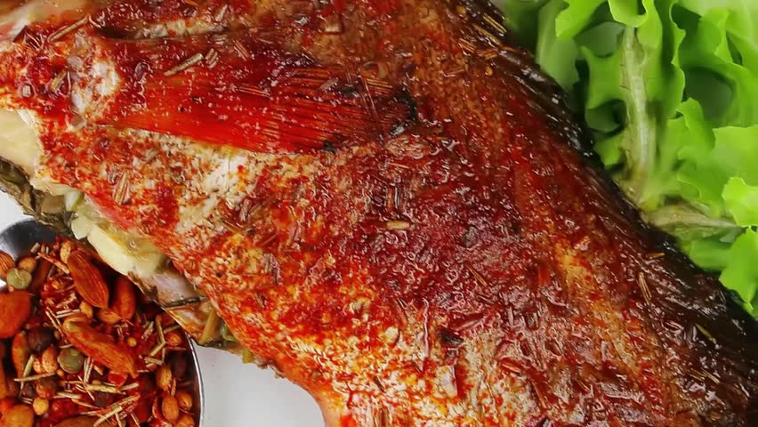 savory on wood: fried fish served with tomatoes lemon and spices