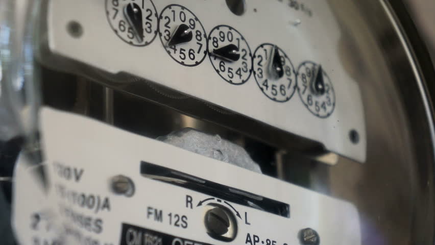 Electrical kilowatt hour meter counting up the electrical costs for the next energy bill.