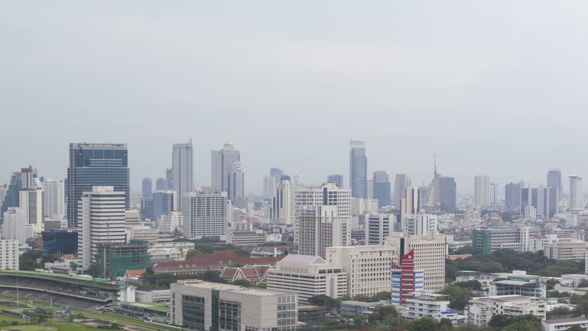 BANGKOK, THAILAND, JUN 01, 2012: Timelapse of Bangkok Skyline and the Royal Bangkok Sports Club hit by a storm during sunset filmed from an elevated position.