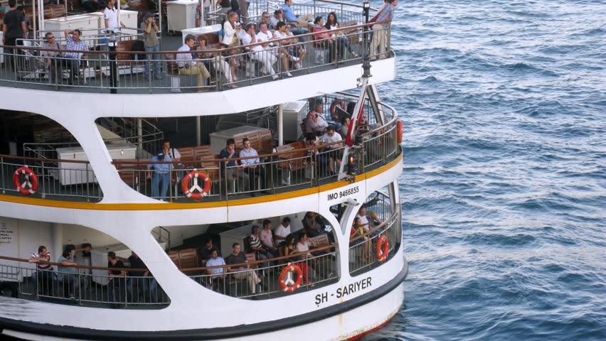 ISTANBUL - JUL 3: (Timelapse View) Tourists sit on decks of walking ship, on Karakoy-Kadikoy ferry, on Jul 3, 2012 in Istanbul, Turkey