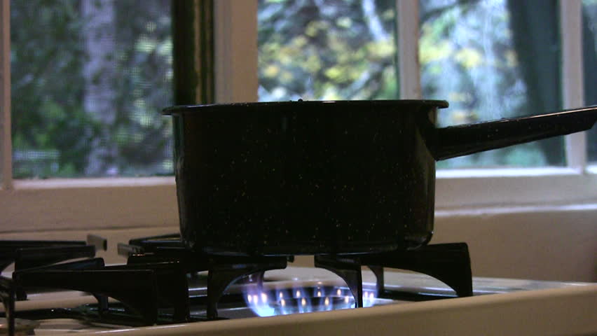 A pot on a stove on a chilly fall day
