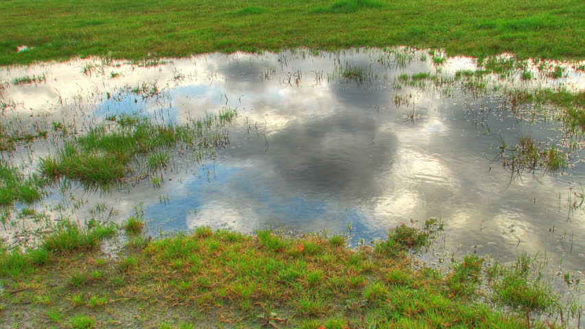 Clouds reflexions in water, HD time lapse clip, High Dynamic Range imaging.