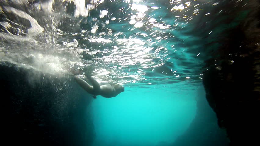 Diver and rocks
Girl diving between the rocks    
