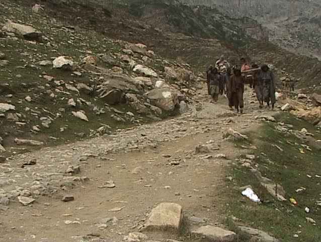 Porters carrying down pilgrims to the holy Amarnath cave in the Himalayas
