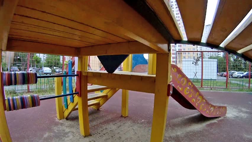 Boy accounts on toy abacus on playground in house yard