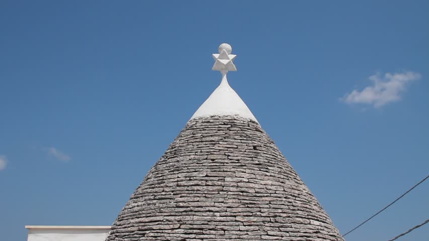 Roof of a trullo, a traditional apulian dry stone hut, typical a specific part of the south of Italy
