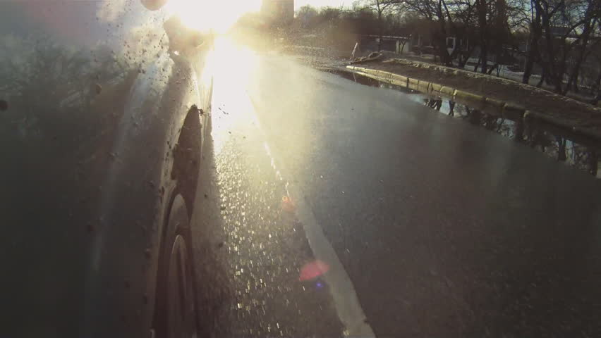 car goes through the puddles