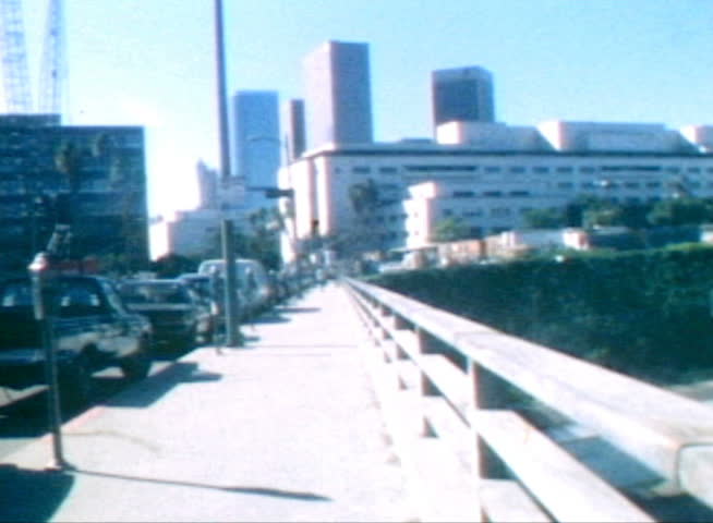 LOS ANGELES, CALIFORNIA - OCTOBER 11:  Vintage super 8 moving time lapse of the downtown LA civic center area on Broadway on October 11, 1988 in Los Angeles, California.