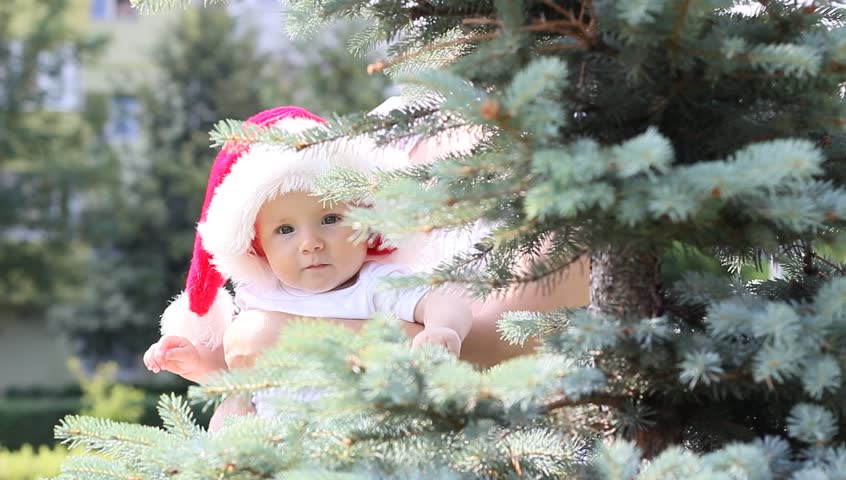 Santa child with red cap waiting the Christmas