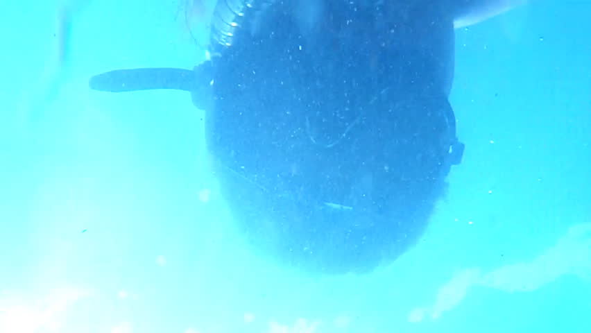 Diver face in the mask underwater view