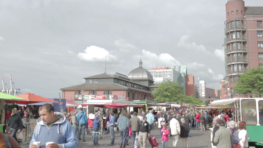 HAMBURG, GERMANY - JUNE 3, 2012: Consumers at Hamburg Fischmarkt. Every Sunday morning from 05:00 a.m. to 09:30 a.m. Hamburgâs historical and traditional Fish market takes place.