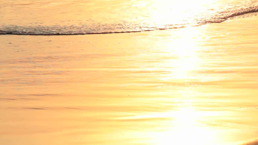Sunset and footsteps on the beach