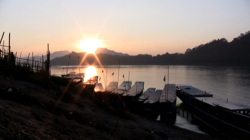 Timelapse of sun setting down on the Mekong river in Luang Prabang Laos 