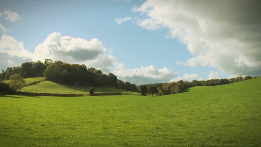 English Landscape, HD. An English countryside scene in the Surrey hills with time lapsed clouds passing overhead.