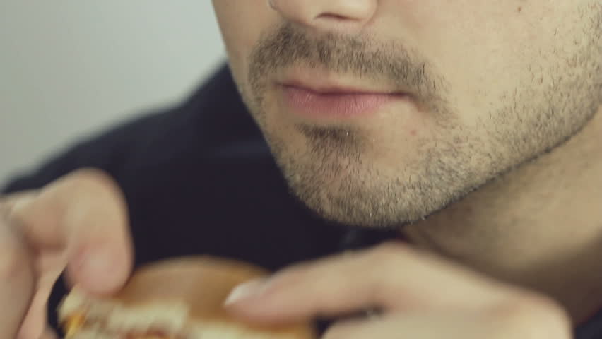 Man eats hamburger
