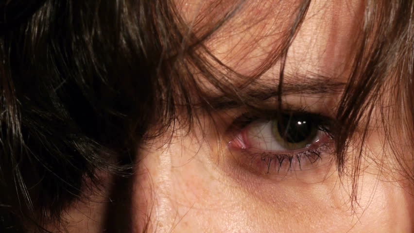 demented woman drug addict dilated eye closeup