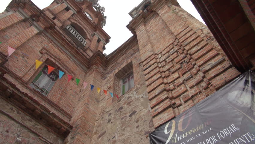 PUERTO VALLARTA, MEXICO - FEBRUARY 1: Pan across the  exterior of Our Lady of Guadalupe church on February 1, 2012 in Puerto Vallarta, Mexico.
