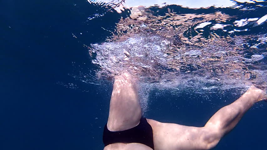 Diver deep under

Description: Man immersing in the sea
